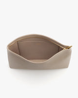 Open pouch with zipper and empty interior viewed from above.