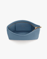 Open pouch with a zipper and internal pocket.