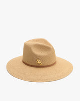 Wide-brimmed hat with small decorative emblem on the band.
