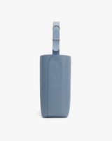 Side view of a structured bag with an adjustable strap.
