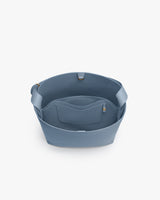 Open tote bag with inner pocket and wide handles.