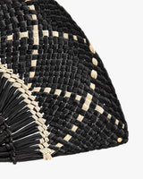 Half-circle woven straw bag with intricate pattern.