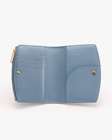 Open wallet with two snap buttons and a zipper compartment.