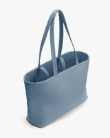 Tote bag with long handles and an open top view.