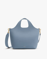 Fashion tote bag with shoulder strap and gold clasps.