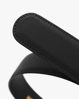 Close-up of a leather belt with stitched detailing.