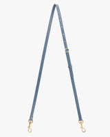 Thin adjustable strap with metal clasps on both ends.