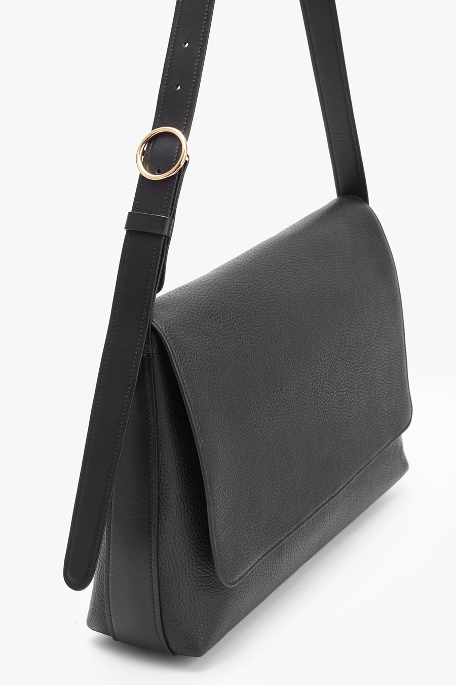 Shoulder bag with an adjustable strap and metal ring.