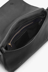 Open leather bag with visible interior pockets and zipper.