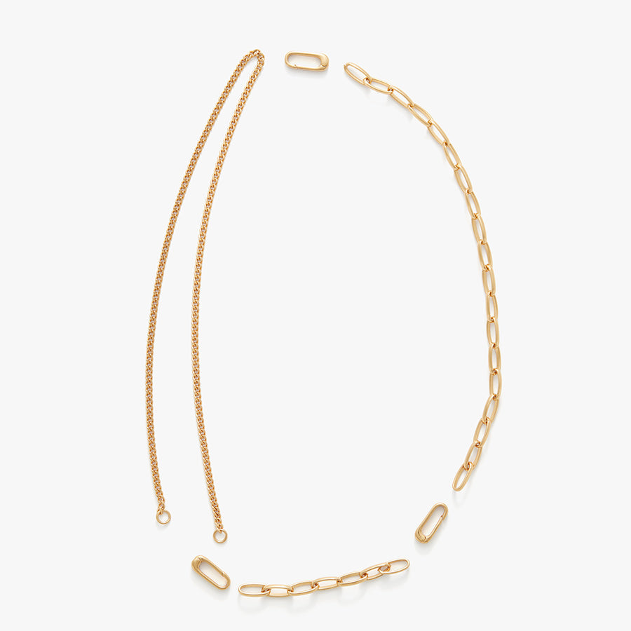 Two necklaces and three clasps laid out on a plain background.