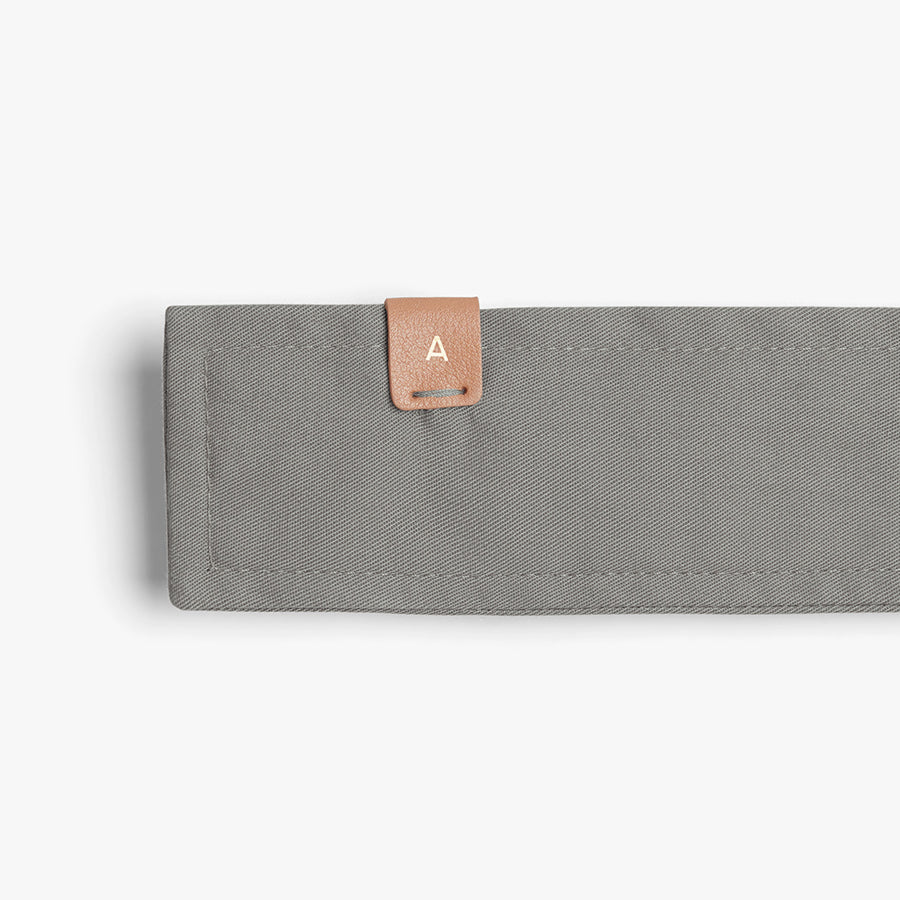 Relaxed Trench Fabric belt with small leather tab attached.