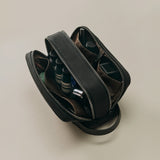 Open camera bag with lenses and accessories visible.