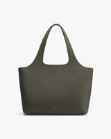 Leather tote bag on a plain background.