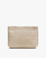 Clutch with fold-over top and textured exterior.