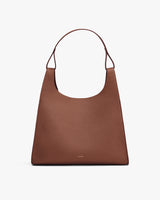 A shoulder bag with a structured top and an open main compartment.