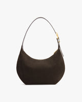 Shoulder bag with a curved shape, adjustable strap and zipper closure displayed upright.