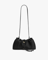 Leather shoulder bag with drawstring closure and long strap.