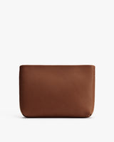 Simple textured leather pouch on a white background.