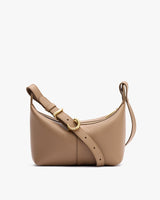 Shoulder bag with a curved top and adjustable strap