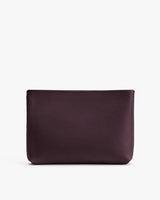 Rectangular textured pouch in a neutral setting.