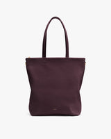 Tote bag with two handles on a plain background.