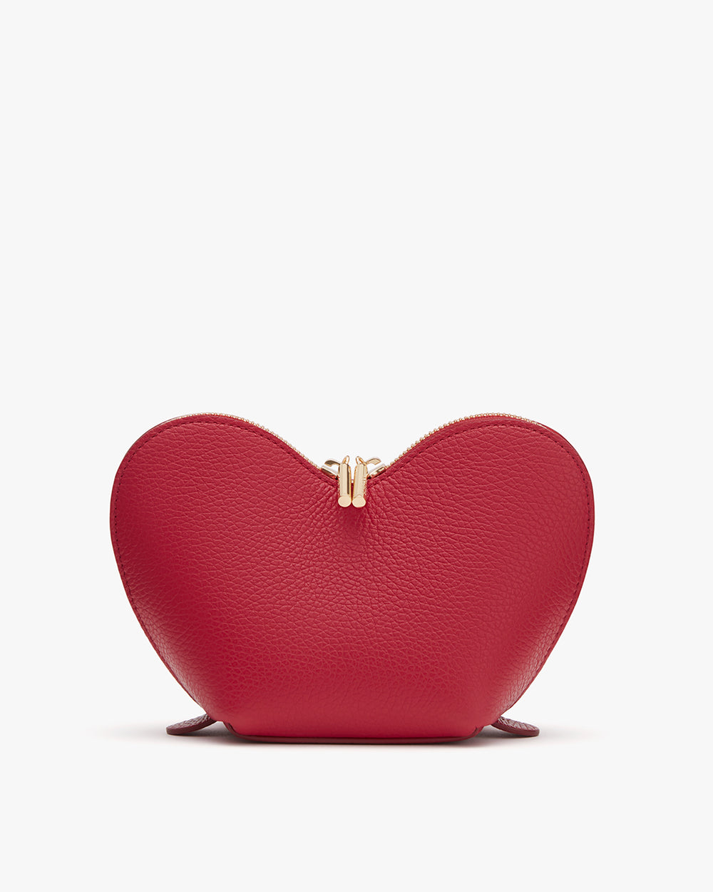 Heart-shaped purse with clasp closure standing upright.