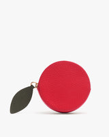 Round coin purse with leaf zipper pull.