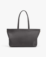 Large tote bag with two handles on a plain background