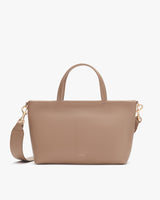 Handbag with top handles and a shoulder strap