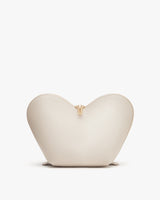 Heart-shaped purse with zipper standing upright