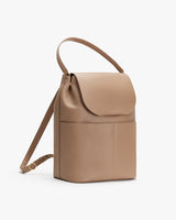 Upright shoulder bag with a flap and an adjustable strap