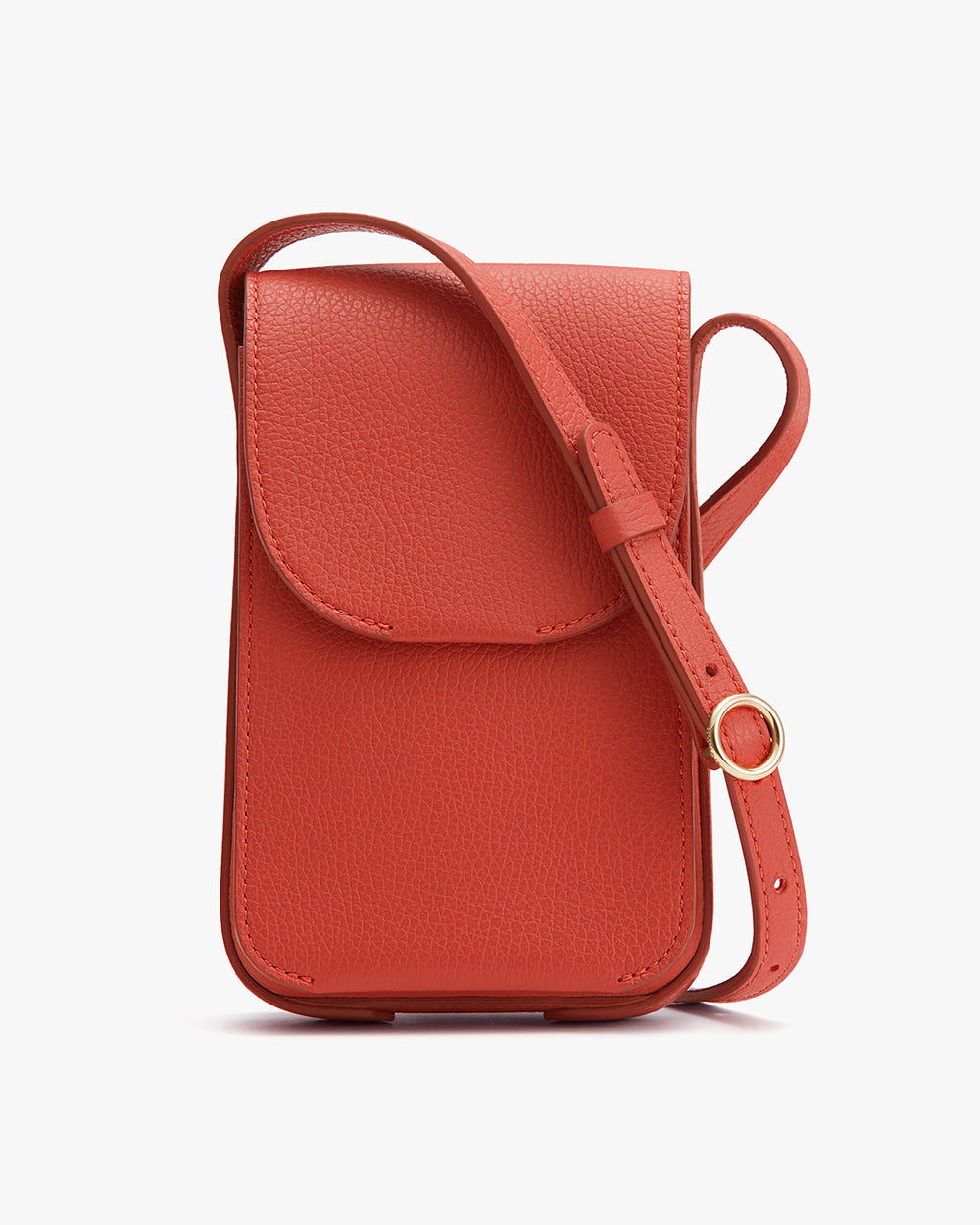 A small textured shoulder bag with a flap and adjustable strap.