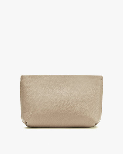 Leather pouch on a plain background