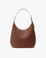Elegant crescent-shaped handbag with a single strap.