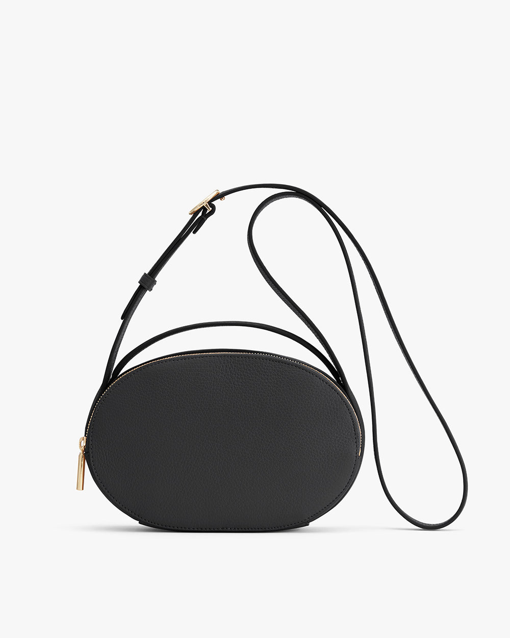 Round purse with a long strap and zipper on a white background