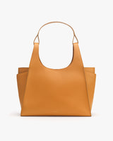 Handbag with two side pockets and top handle