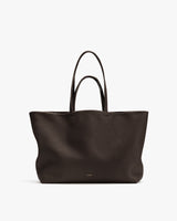 Large tote handbag with two handles shown upright