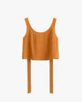 Sleeveless cropped top with overhanging long back straps.