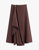 Asymmetrical wrap skirt with draped detail.