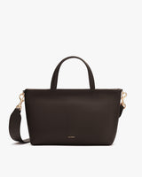 Handbag with shoulder strap and two handles shown.