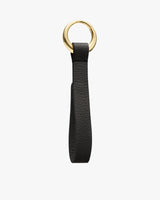 Leather keychain with a loop and gold ring.