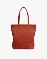 Tote bag with long handles on plain background