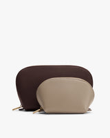 Two zipper pouches, one larger behind a smaller one.