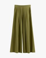 Wide-leg pants with pleats on a plain background.