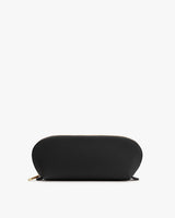 Semi-circular zippered pouch on plain background.