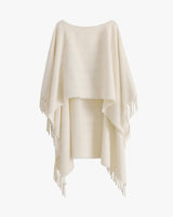 Fringed cape with a draped design shown on display.