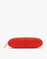 Oval-shaped quilted pouch with a zipper.