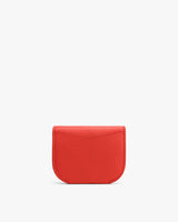 Small textured wallet on a plain background.