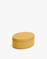 Round zippered case on a white background.