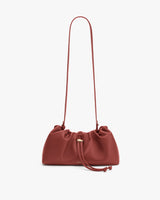 Gathered drawstring shoulder bag with long strap.